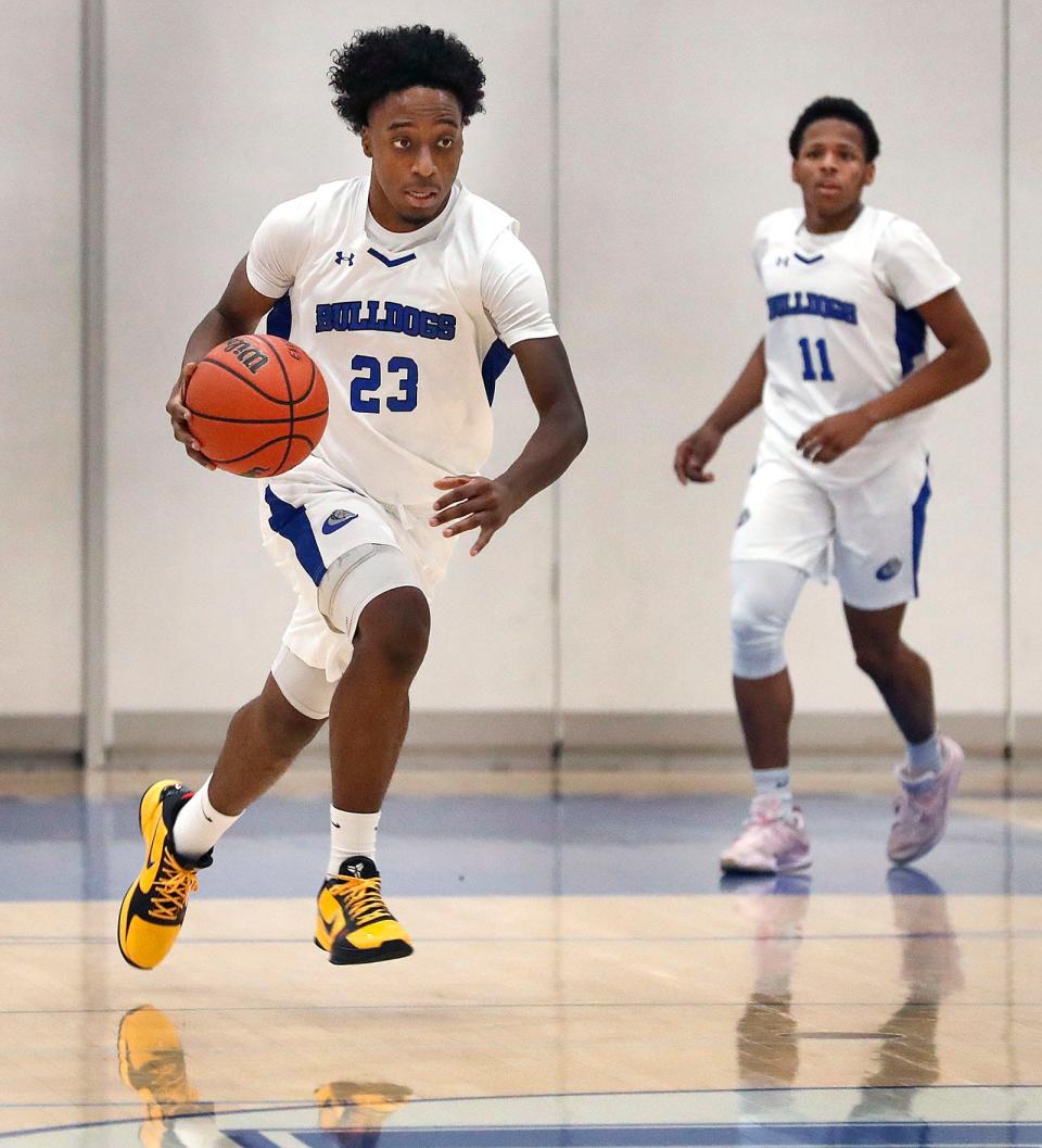 Guard Armani Perkins breaks down court .
The Holbrook Bulldogs hosted Excel Academy in boys basketball on Tuesday Dec. 19, 2023