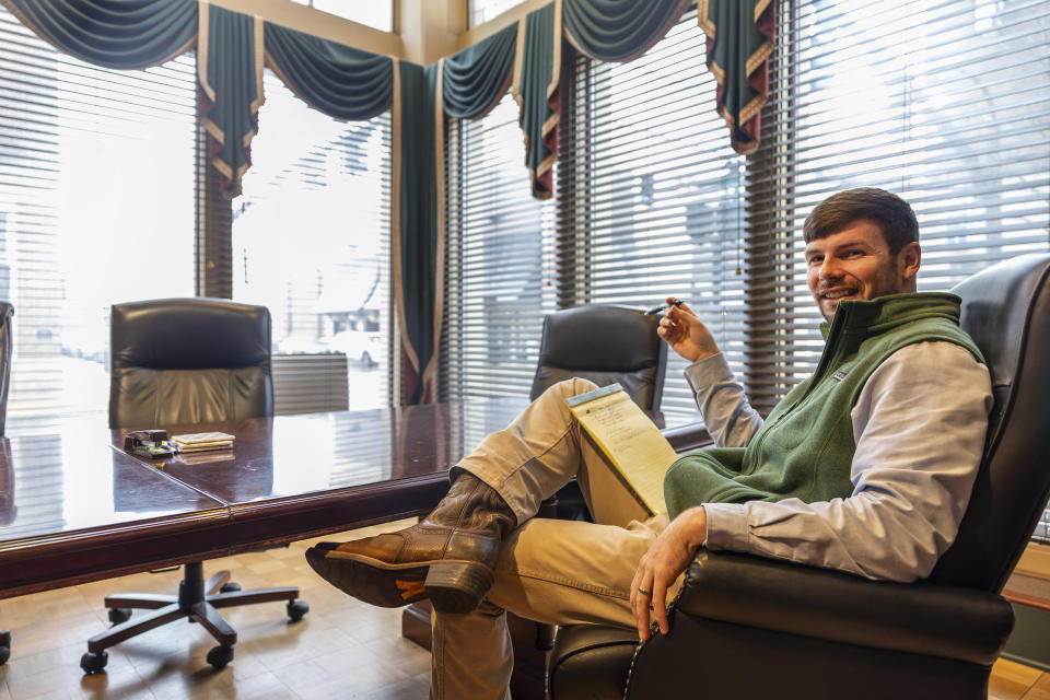 Hunter Garnett, of Garnett Patterson Injury Lawyers, poses at his law office near the Madison County courthouse, Thursday, Jan. 25, 2024, in Huntsville, Ala. Garnett is seeking a smaller office space in the suburbs closer to his clients, rather than the large space he has now. (AP Photo/Vasha Hunt)