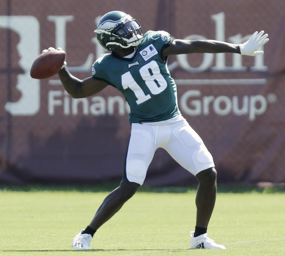 Philadelphia Eagles wide receiver Jalen Reagor throws the football during an NFL football training camp practice in Philadelphia, Monday, Aug. 17, 2020. (Yong Kim/Pool Photo via AP)