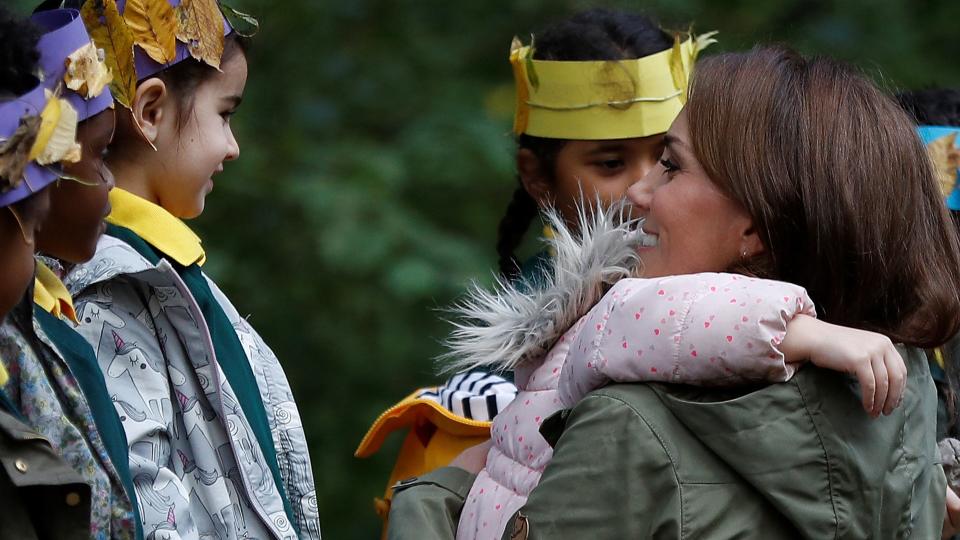 Kate Middleton hugging a schoolgirl