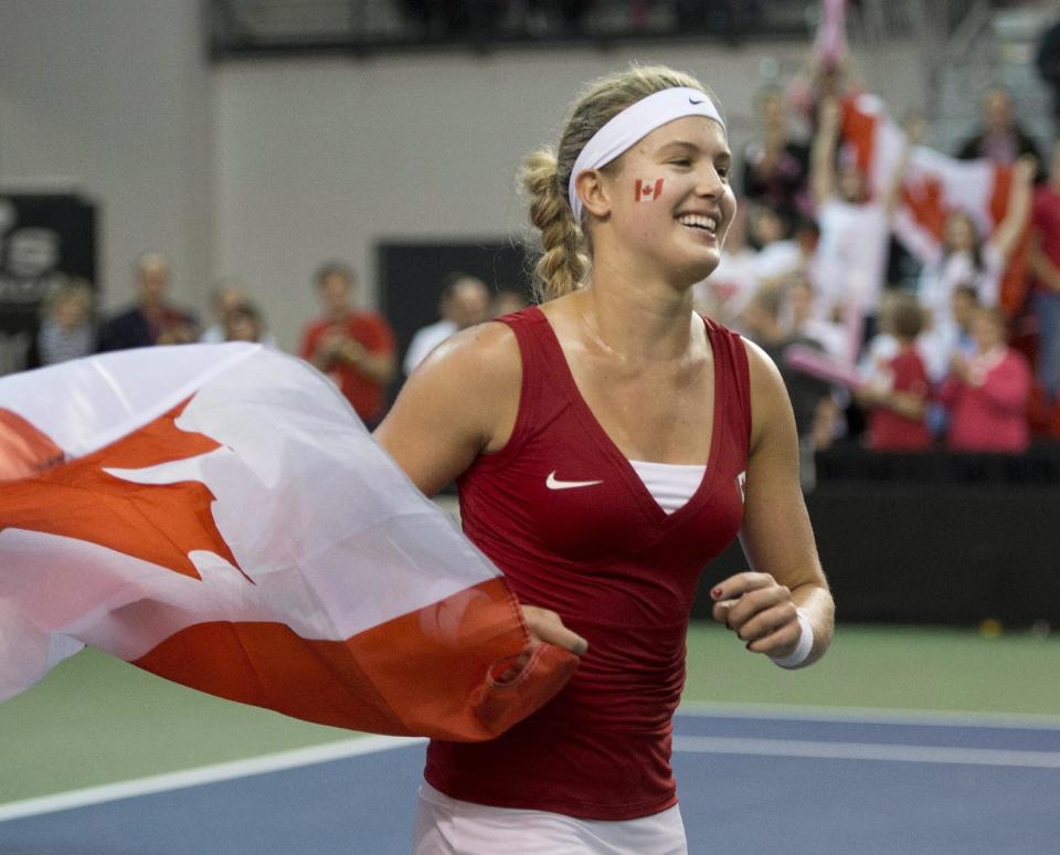 Eugenie Bouchard, of Canada, celebrates her win against Jana Cepelova, of Slovakia, during the third match at the Fed Cup tennis tournament at Laval University in Quebec City on Sunday, April 20, 2014. Bouchard won the match. (AP Photo/The Canadian Press, Jacques Boissinot)
