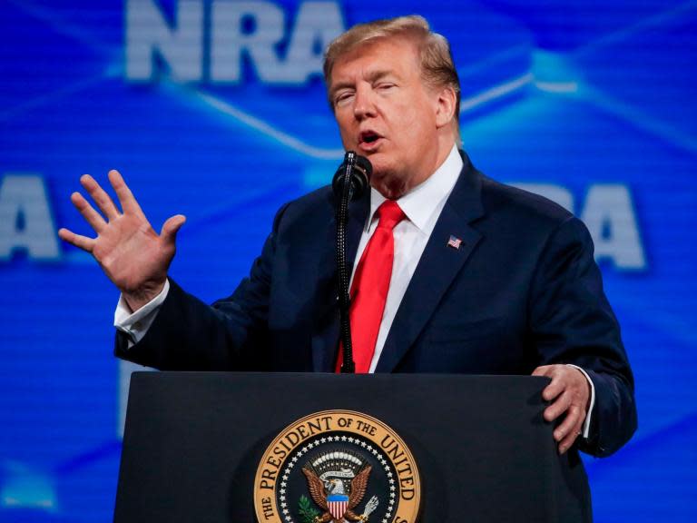 Donald Trump has re-enacted the Paris terror attacks in front of a group of gun owners and lovers during a speech to the National Rifle Association, where he also signalled his intention to deliver a major policy victory to the pro-gun group.During his wide ranging speech, Mr Trump claimed that the 2015 terror attack in the French capital was so deadly because of the country’s very strict gun control laws. He said that if “there was one gun being carried by one person on the other side, it very well could've been a whole different result.”Then, the president continued to re-enact the massacre, using his hands to imitate gun fire: “Get over here! Boom. Get over here! Boom. And then they left.”Mr Trump’s pantomiming of a massacre that left 130 victims dead and more than 350 injured was accompanied by his declaration that he would pull his signature from the United Nations Arms Trade Treaty — a global agreement intended to prevent illicit arms sales.The president cited concerns raised by conservative groups in opposition to the treaty, saying that the international agreement between roughly 100 countries would potentially subject US gun owners to internationally drafted rules.“We will never allow foreign bureaucrats to trample on your Second Amendment freedom,” Mr Trump said during his speech to the NRA in Indianapolis. “I’m officially announcing today that the United States will be revoking the effect of America’s signature from this badly misguided treaty.”Gun control advocates quickly pushed back on the president’s decision to pull the US out of that treaty, which was singed by President Barack Obama but never ratified by Congress.Kris Brown, the president of the Brady Campaign, said that the president’s decision illustrated Mr Trump’s eagerness to “pander” to the NRA, and that the decision would “embolden terrorists”.“Today, President Trump chose to pander to the corporate gun lobby and shirk his responsibility to his country and the world. We should be doing everything in our power to stop gun violence, not export it,” Mr Brown said.He continued: “By denouncing the treaty today, President Trump will only embolden terrorists and other dangerous actors around the world. This is a dangerous, reckless move that will endanger countless Americans and other innocent people worldwide.“