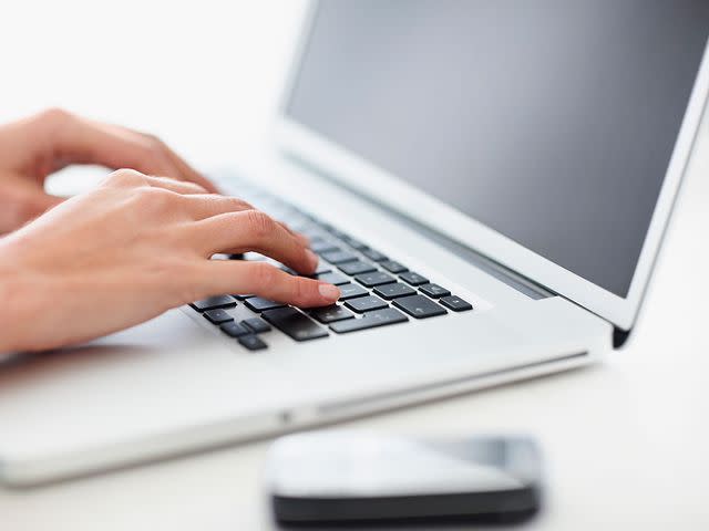 Momentimages/Getty Stock image of a person typing on a keyboard