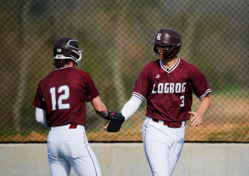 Logan-Rogersville's Ross Lawrence and Curry Sutherland celebrate after scoring runs as the Wildcats take on the Marshfield Blue Jays on Thursday, April 13, 2023.