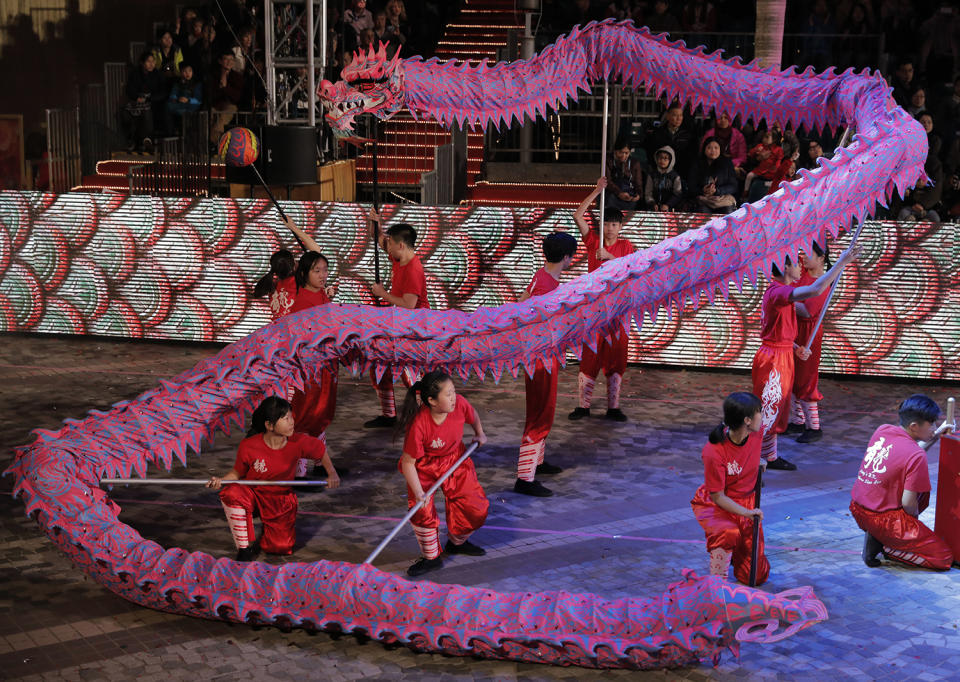 Performers show a dragon dance in a night parade to celebrate Chinese New Year in Hong Kong, Saturday, Jan. 28, 2017. The Lunar New Year this year marks the Year of the Rooster in the Chinese calendar. (AP Photo/Vincent Yu)