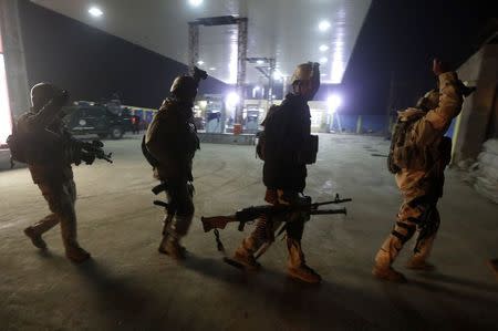 Afghan security forces arrive at the site of a Taliban assault in Kabul November 19, 2014. REUTERS/ Omar Sobhani