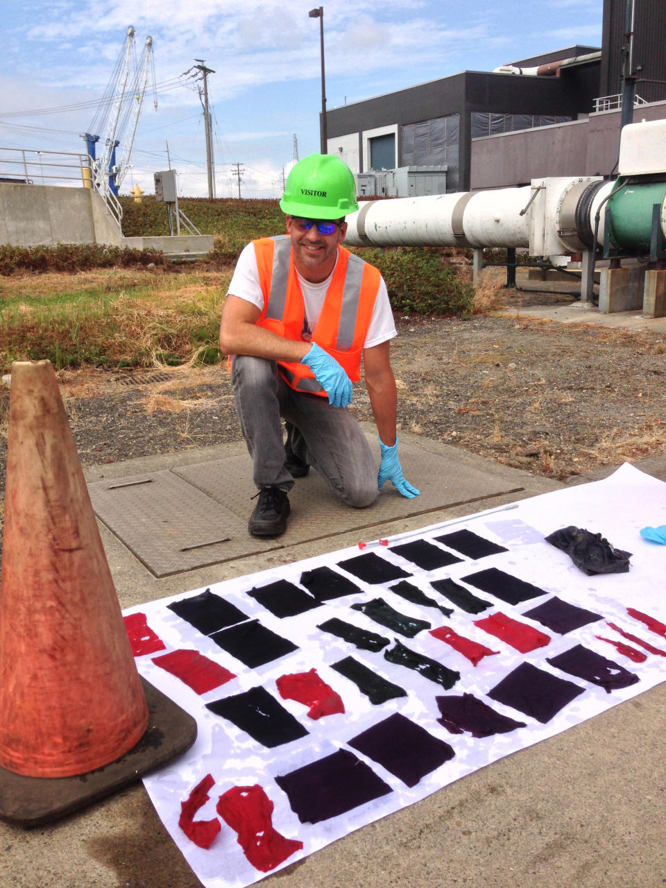 In this Aug. 16, 2013 photo provided by the City of Vancouver, Industrial Pretreatment Coordinator Frank Dick poses with flushable wipes that made it through a test to see if they would break down, at the Westside Wasterwater Treatment Plant in Vancouver, Wa. Various bathroom wipes were specially dyed and then sent through the sewer system, but instead of dissolving, most wound up intact. (AP Photo/ City of Vancouver)