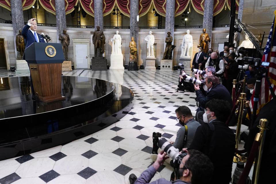 President Joe Biden speaks from Statuary Hall at the U.S. Capitol to mark the one year anniversary of the Jan. 6 riot at the Capitol by supporters loyal to then-President Donald Trump, Thursday, Jan. 6, 2022, in Washington. (AP Photo/Andrew Harnik)