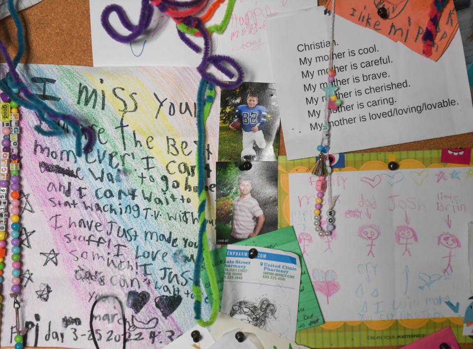 A wall artwork and letters from Christian Banley’s children, inside of her home in Aberdeen, South Dakota, on Wednesday, Aug. 23, 2023.
