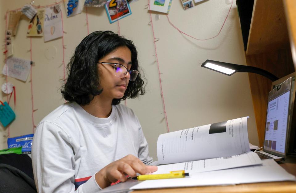 University of Michigan freshman Padma Danturty, 19, works on history homework in her dorm room Saturday, Feb. 12, 2022. Danturty is among thousands of u0022documented dreamers,u0022 children of legal immigrants on temporary work visas who have lived in the U.S. for most of their lives, but may face deportation upon turning 21.