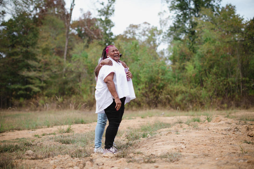 Image: Bettersten Wade is comforted by her sister. (Ashleigh Coleman for NBC News)