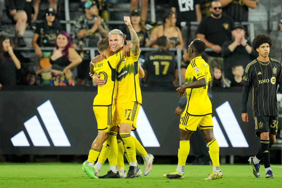 Jul 13, 2024; Los Angeles, California, USA; Columbus Crew forward Christian Ramirez (17) celebrates with teammates after scoring a goal in the second half against LAFC at BMO Stadium. Mandatory Credit: Kirby Lee-USA TODAY Sports