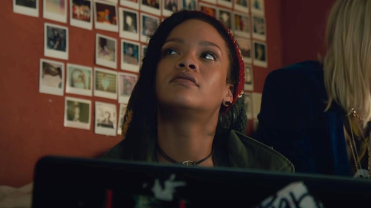  Rihanna sitting by a laptop in Ocean's Eight. 