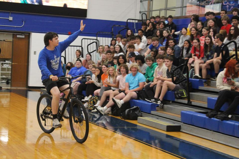 Chillicothe High School student Jackson Oyer showed off his new bicycle that he won at the Keys to Success event at CHS on May 8, 2023.