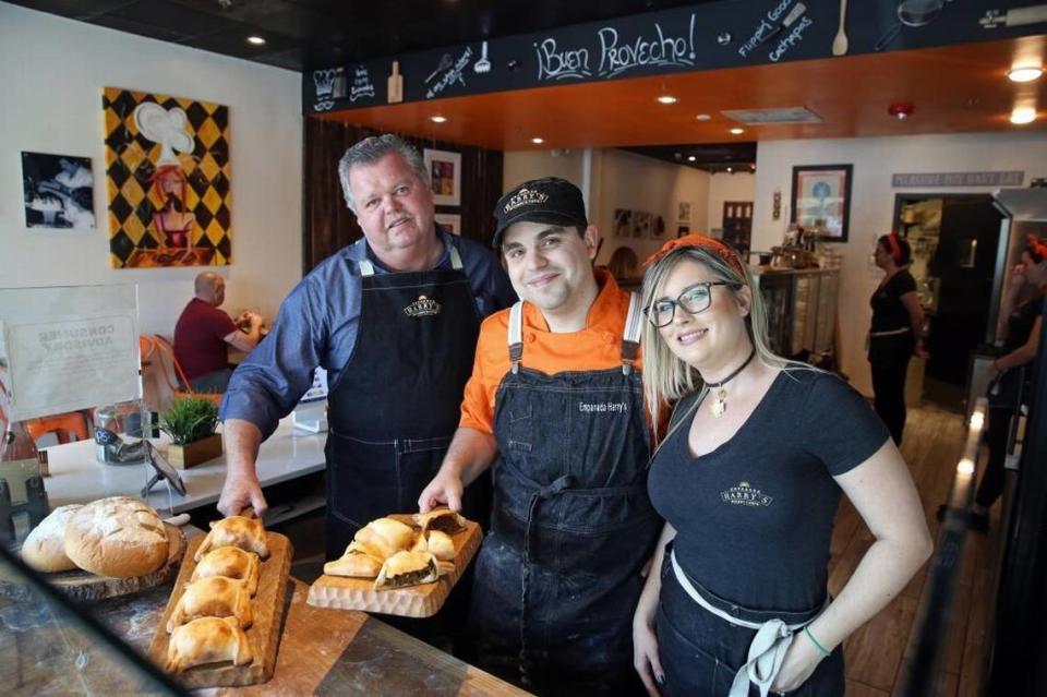 Empanada Harry’s in the days before the coronavirus. Since then, Harry Coleman (middle) pictured with wife Michelle and his father, Philip, have required staff to get the coronavirus vaccine.