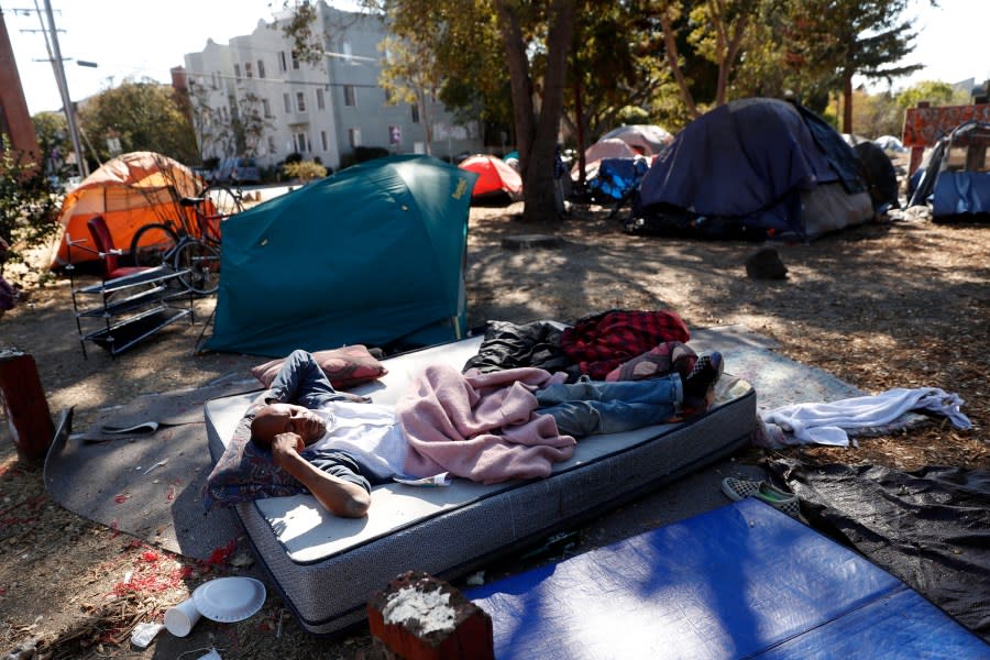 BERKELEY, CA – SEPTEMBER 30: Rusty James, Jr. lays on a mattress in People’s Park in Berkeley, Calif., on Tuesday, September 28, 2021. UC Berkeley plans to build housing for students and the indigent at People’s Park, against the wishes of some opponents, including those who want to preserve the park as it’s been for generations. (Scott Strazzante/San Francisco Chronicle via Getty Images)