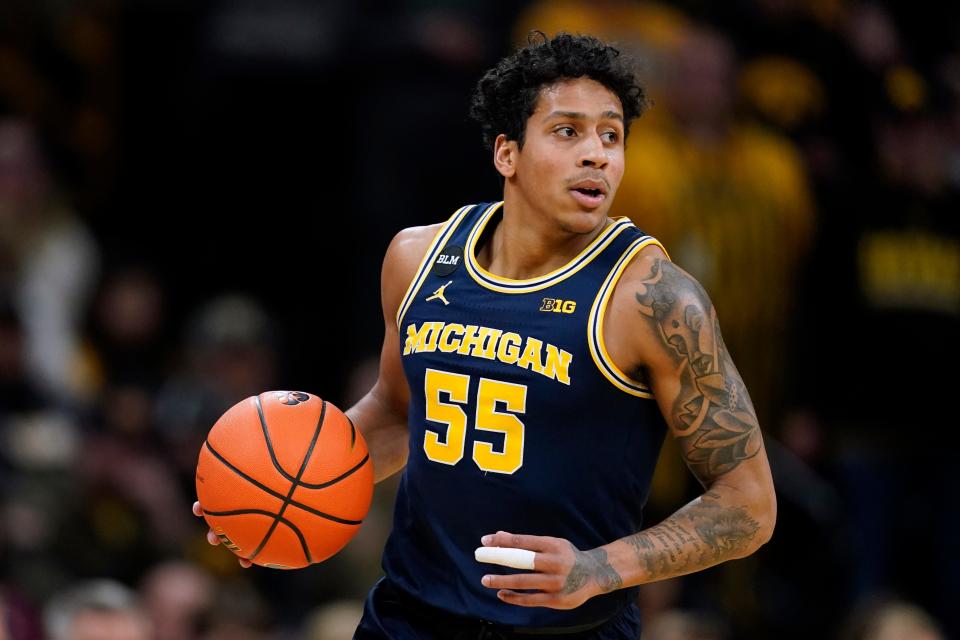 Michigan guard Eli Brooks drives up court during the first half of an NCAA college basketball game against Iowa, Thursday, Feb. 17, 2022, in Iowa City, Iowa. (AP Photo/Charlie Neibergall)