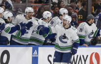 Vancouver Canucks' Elias Lindholm (23) celebrates a goal with teammates during the second period of Game 3 of an NHL hockey Stanley Cup second-round playoff series against the Edmonton Oilers in Edmonton, Alberta, Sunday, May 12, 2024. (Jason Franson/The Canadian Press via AP)