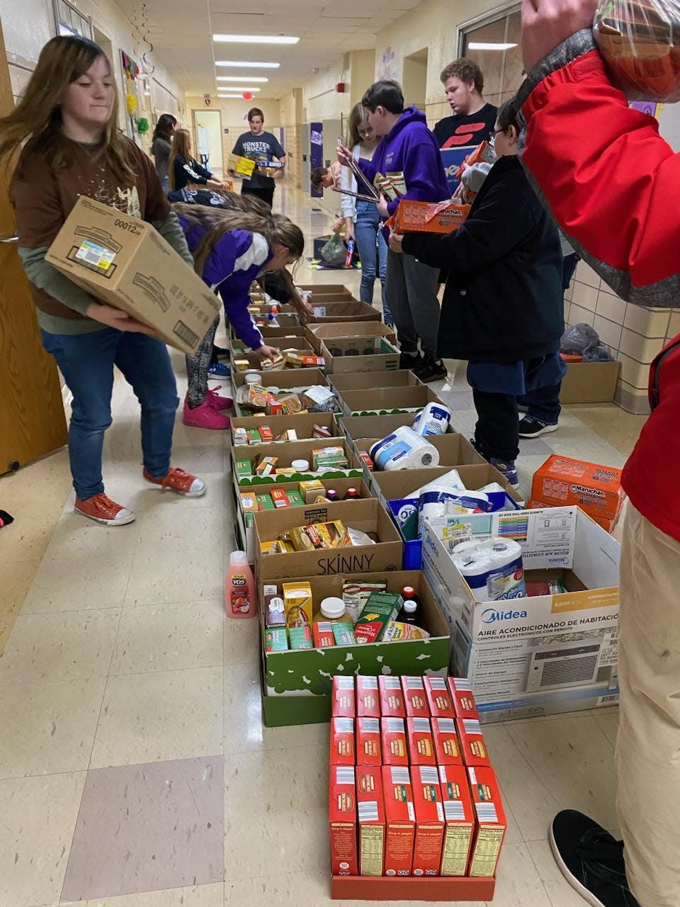 Sebring McKinley students sort donations of pantry staples and holiday feast supplies on Monday, Nov. 21, 2022, as part of the school's Junior High School Senate food drive.