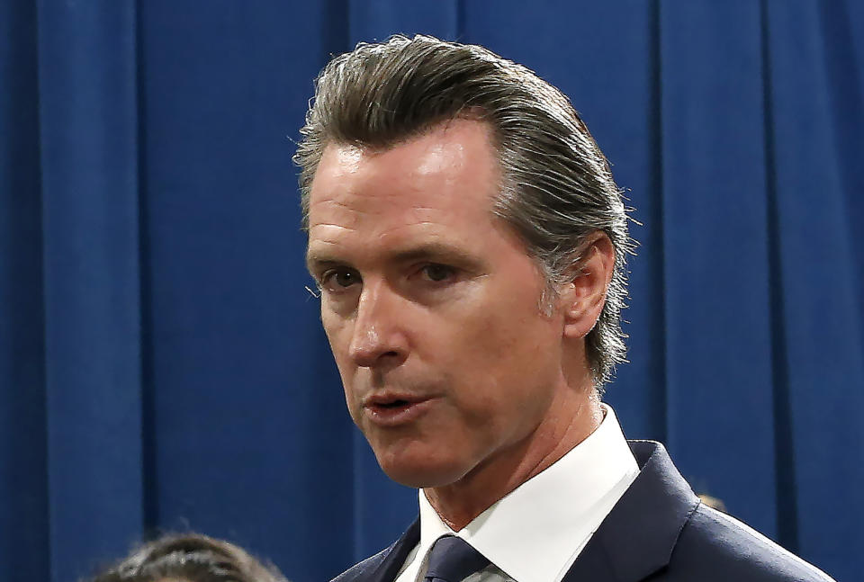 California Gov. Gavin Newsom, discusses the lawsuit the state has filed against the Trump administration's new rules blocking green cards for many immigrants who receive government assistance, during a news conference in Sacramento, Calif., Friday, Aug. 16, 2019. California, three other states and the District of Columbia filed the suit Friday against some of the administration's most aggressive moves to restrict legal immigration that are supposed to take effect in October. (AP Photo/Rich Pedroncelli)