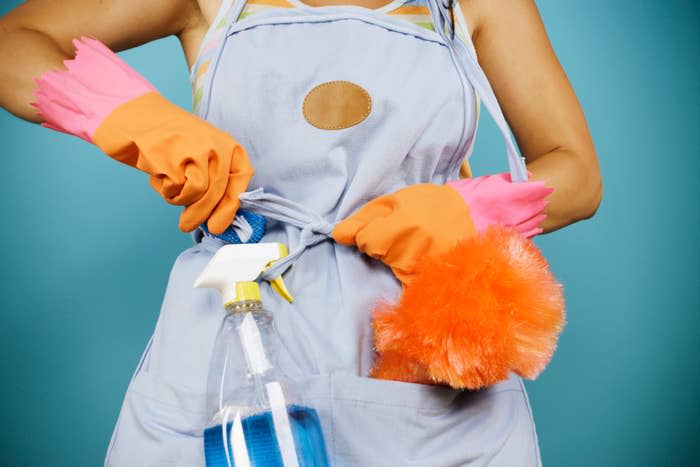 housekeeper tightening apron