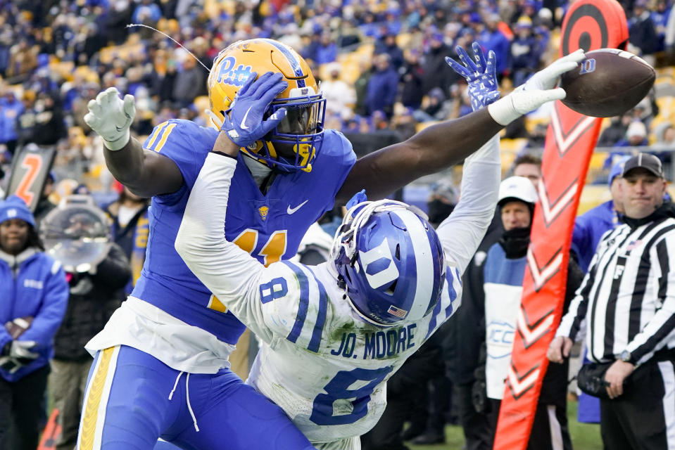 APTOPIX —Pittsburgh linebacker Bangally Kamara (11) deflects a pass to Duke wide receiver Jordan Moore (8) in the end zone during the second half of an NCAA college football game, Saturday, Nov. 19, 2022, in Pittsburgh. Pittsburgh won 28-26. (AP Photo/Keith Srakocic)