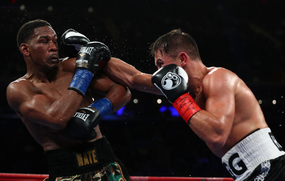 Daniel Jacobs (L) and IBF-WBA-WBC middleweight champion Gennady Golovkin, showing fighting in March, could be in line to fight the Billy Joe Saunders-David Lemieux winner. (Getty Images)