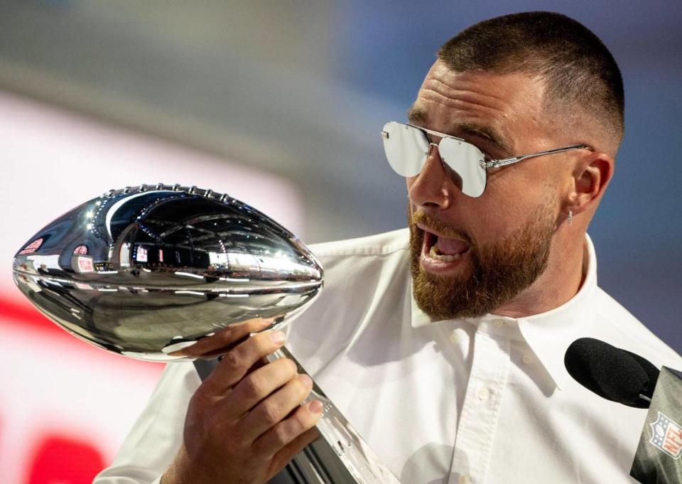 Kansas City Chiefs tight end Travis Kelce shouts while holding the Vince Lombardi Super Bowl Trophy during the NFL Draft outside of Union Station on Thursday, April 27, 2023, in Kansas City.