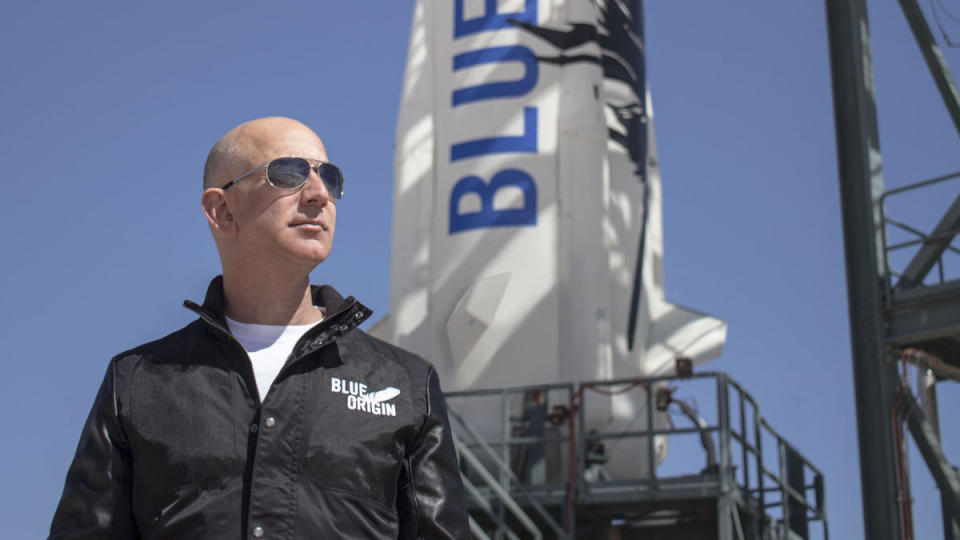 Jeff Bezos photographed in front of Blue Origin's New Sheppard rocket.