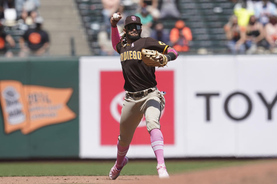 San Diego Padres shortstop Fernando Tatis Jr. throws out San Francisco Giants' Austin Slater at first base during the fifth inning of a baseball game in San Francisco, Sunday, May 9, 2021. (AP Photo/Jeff Chiu)