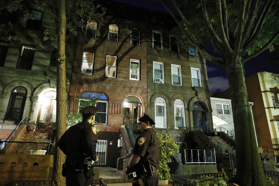 Police stand guard outside the Brooklyn residence of Cathleen Alexis, mother of suspected Washington Navy Yard shooter Aaron Alexis, in New York September 16, 2013. The U.S. military veteran opened fire at the Washington Navy Yard on Monday in a burst of violence that killed 13 people, including the gunman, and set off waves of panic at the military installation just miles from the White House and U.S. Capitol. The FBI identified the suspect as Aaron Alexis, 34, of Fort Worth, Texas, a Navy contractor who had two gun-related brushes with the law. (REUTERS/Andrew Kelly)