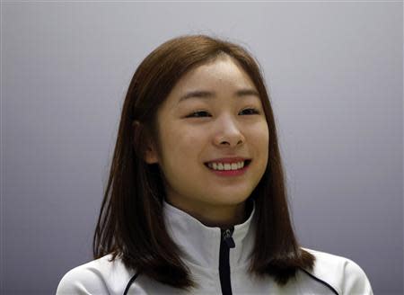 South Korean figure skater Kim Yuna attends a news conference ahead of the Sochi 2014 Winter Olympics, at the Taereung National Training Center in Seoul October 30, 2013. REUTERS/Kim Hong-Ji