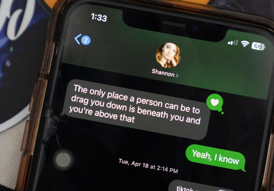 A text on Lana Hiott's phone from her sister, Shannon, states "The only place a person can be to drag you down is beneath you and you're above that." Shannon Hiott was killed in her home in August.