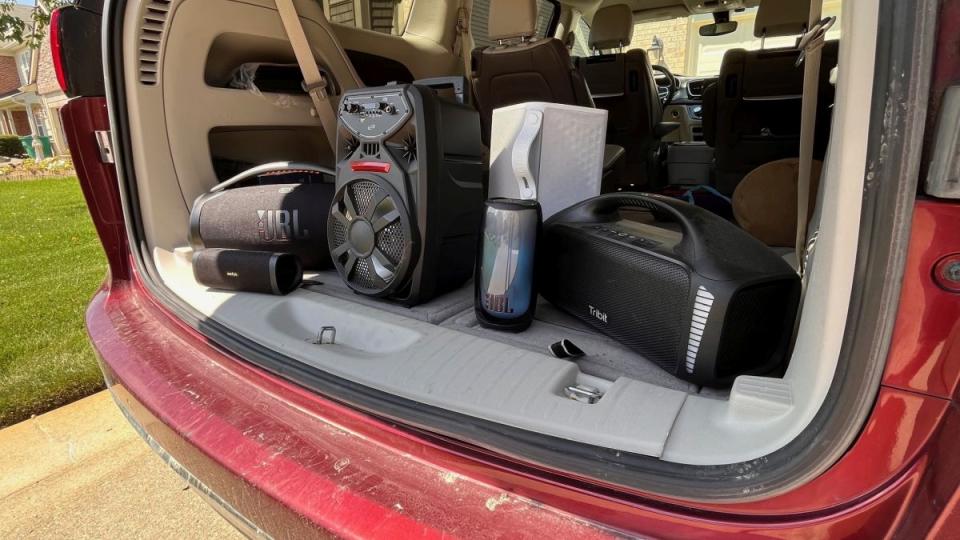 Tailgate speakers arranged in the back of a van.