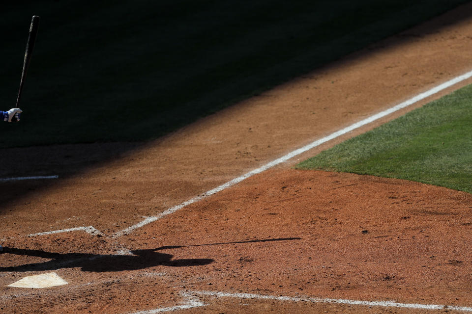 Some players have said they don't want to play during the pandemic but are planning to for now, as Major League Baseball opens camps this week. (AP Photo/Julio Cortez)