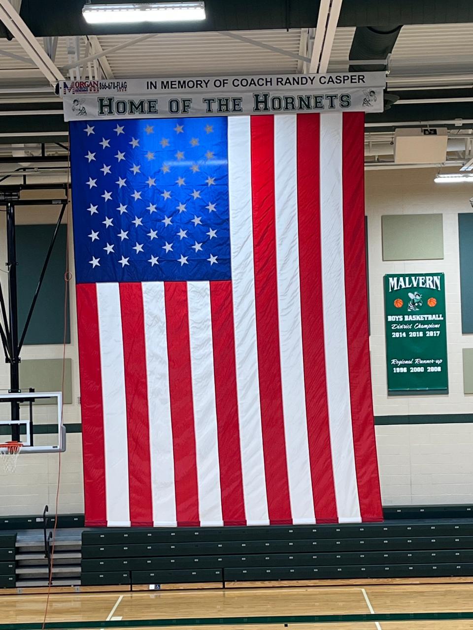 A new American flag hangs in the Malvern High School gym in memory of longtime coach Randy Casper.