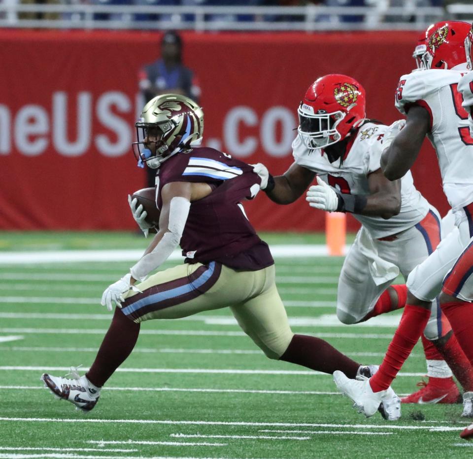 Michigan Panthers running back Reggie Corbin is tackled by New Jersey Generals linebacker Chris Orr during the second half of the Panthers' 28-13 loss to the Generals on Sunday, April 30, 2023, at Ford Field.