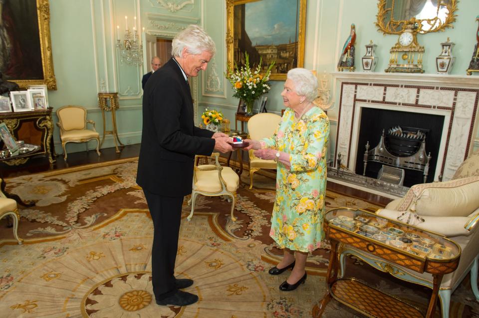 Queen Elizabeth II presents Sir James Dyson with the insignia with the insignia of members of the Order of Merit, during a private audience at Buckingham Palace, London.