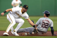 Detroit Tigers' Parker Meadows (22) steals second as the throw from Pittsburgh Pirates catcher Joey Bart (not shown) is knocked out of the glove of second baseman Jared Triolo, left, during the first inning of a baseball game in Pittsburgh, Monday, April 8, 2024. (AP Photo/Gene J. Puskar)