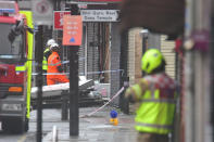 Emergency services inspecting damage at the scene of a suspected gas explosion on King Street in Ealing, west London. Rescuers are involved in a "complex" search for anyone who may still be inside the collapsed building.