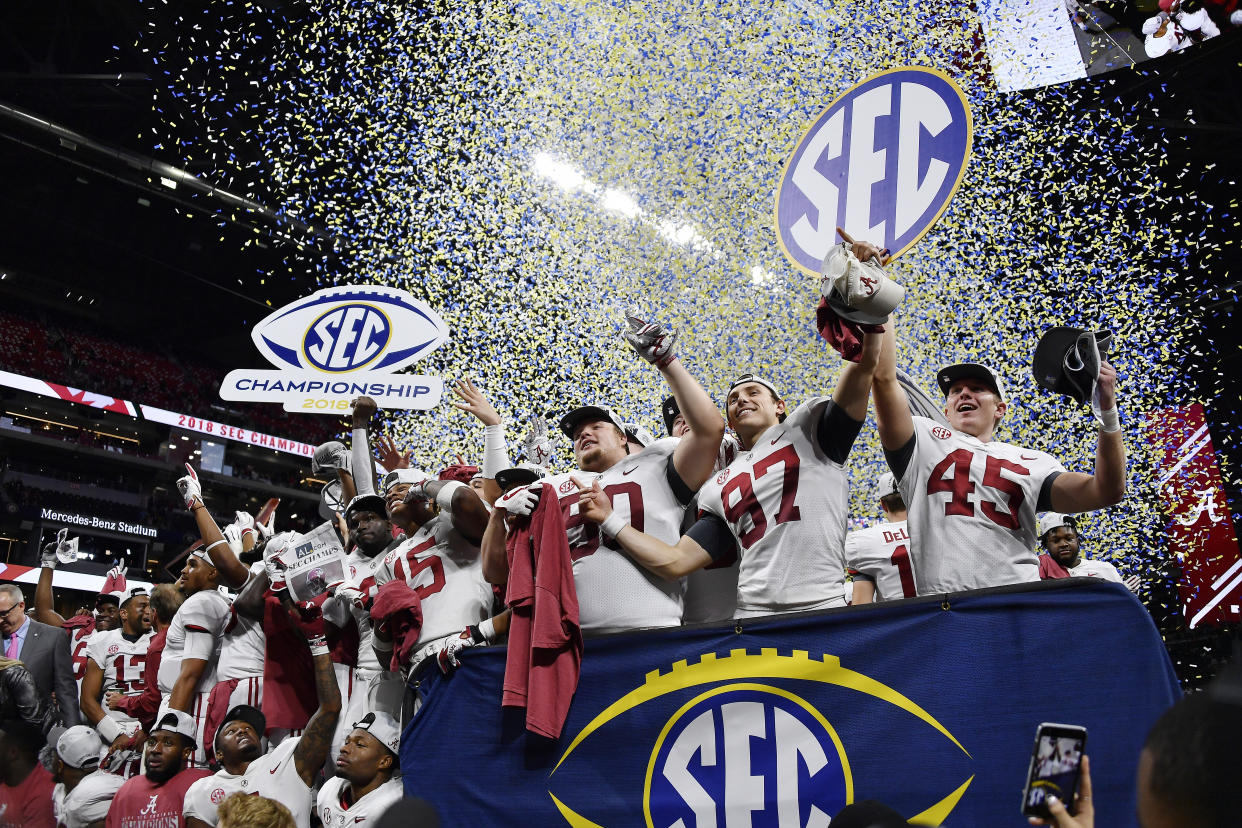 Alabama players celebrate after the Southeastern Conference championship NCAA college football game against Georgia, Saturday, Dec. 1, 2018, in Atlanta. Alabama won 35-28. (AP Photo/John Amis)