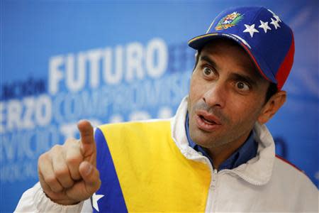 Miranda's state governor and opposition leader Henrique Capriles speaks during an interview with Reuters in Caracas February 26, 2014. REUTERS/Marco Bello