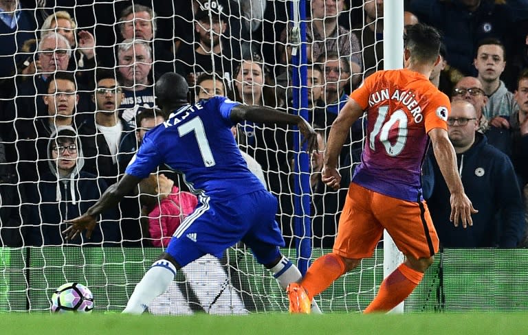 Manchester City's striker Sergio Aguero scores his team's first goal during the English Premier League football match between Chelsea and Manchester City at Stamford Bridge in London on April 5, 2017