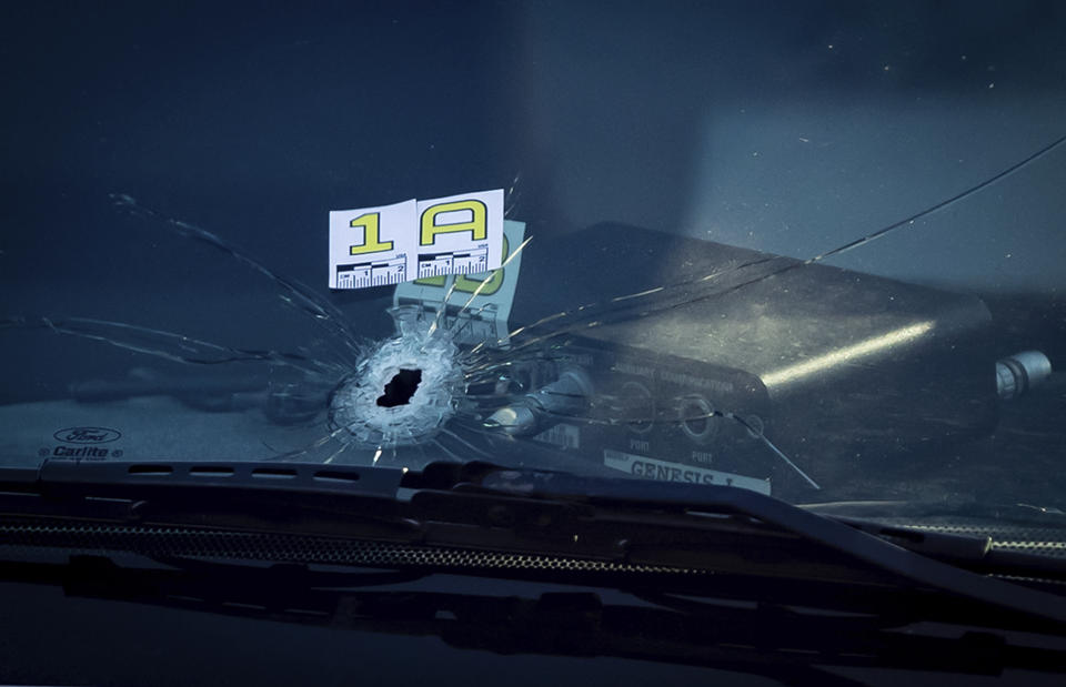 A bullet hole is seen in the windshield of an RCMP vehicle approximately 4 km from Vancouver International Airport after a one person was killed during a shooting outside the international departures terminal at the airport, in Richmond, British Columbia, Sunday, May 9, 2021. (Darryl Dyck/The Canadian Press via AP)