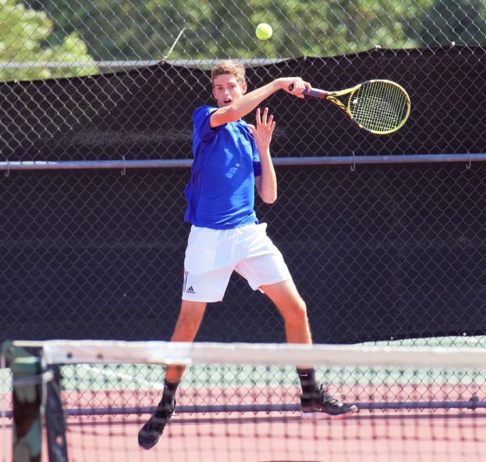 Martin County's Jaden de Windt hits a return during a 3A regional semifinal tennis match at Martin County High School on Tuesday, Apr. 19, 2022. The Tigers won 4-1 to advance in the state tournament.