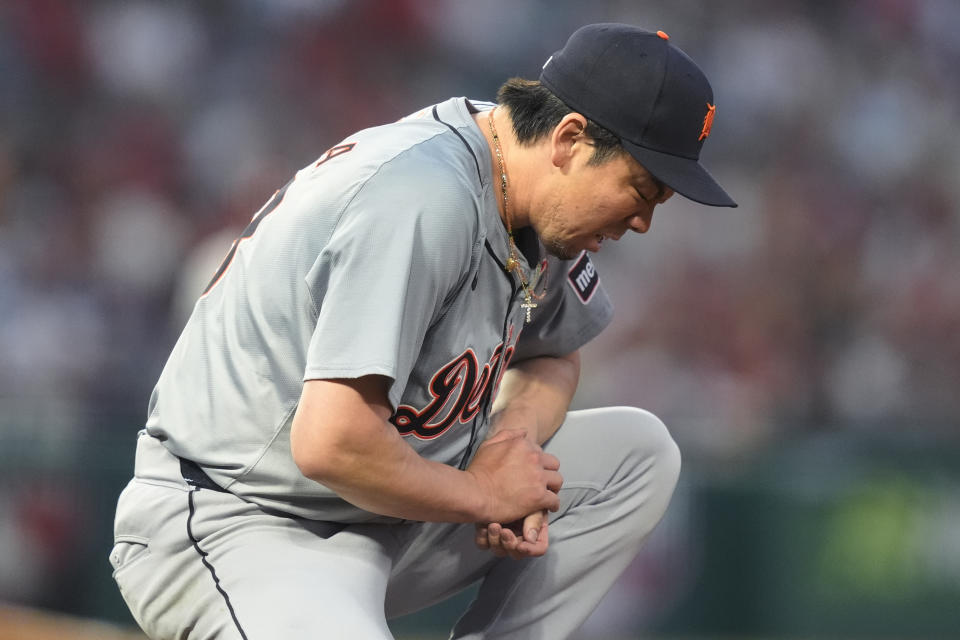 Detroit Tigers starting pitcher Kenta Maeda reacts after deflecting a line-drive single hit by Los Angeles Angels' Taylor Ward during the sixth inning of a baseball game, Friday, June 28, 2024, in Anaheim, Calif. (AP Photo/Ryan Sun)