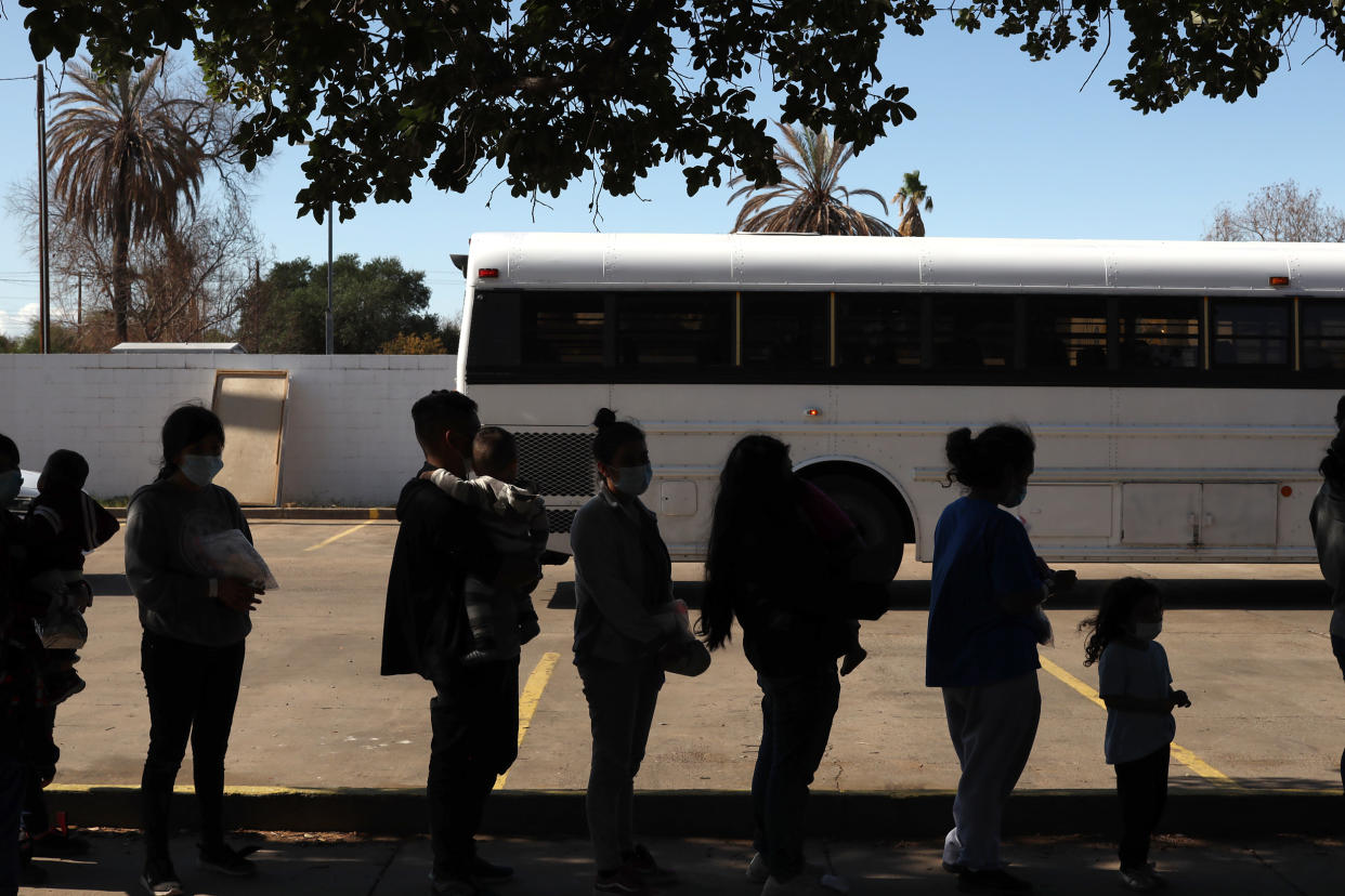 Migrants stand in line outside the Holding Institute shelter in Laredo, Texas on  May 15, 2021. (Jonathan Alpeyrie / Bloomberg via Getty Images file)