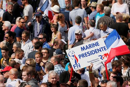 Supporters of Marine Le Pen, French National Front (FN) political party leader and Member of the European Parliament, attend a FN political rally in Brachay, France, September 3, 2016. REUTERS/Gonzalo Fuentes