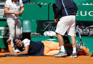 Tennis - Monte Carlo Masters - Monaco, 22/04/2017. Lucas Pouille of France receives medical care during his match against Albert Ramos-Vinolas of Spain. REUTERS/Eric Gaillard