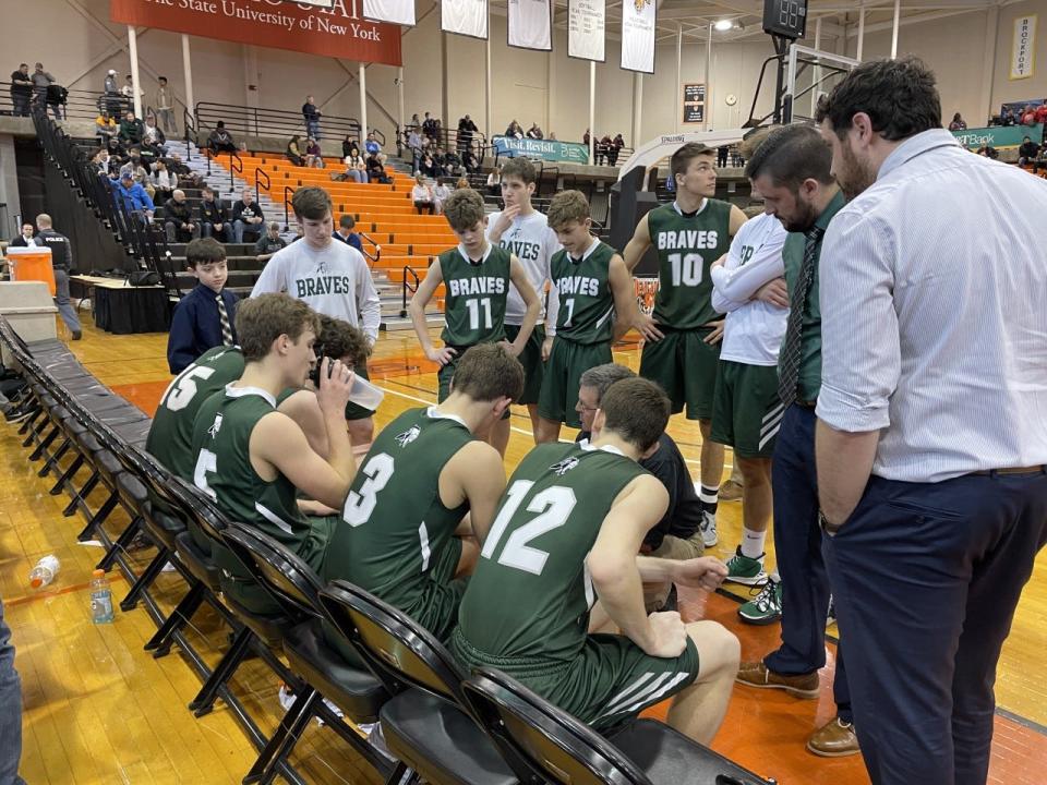 Avon coach Rob Fries preps his team during the NYSPHSAA Class C Far West Regionals at Buffalo State College. Salamanca defeated Avon 61-59.